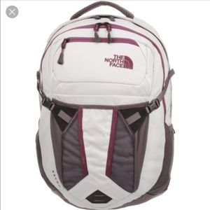 Purple and white north face recon backpack.